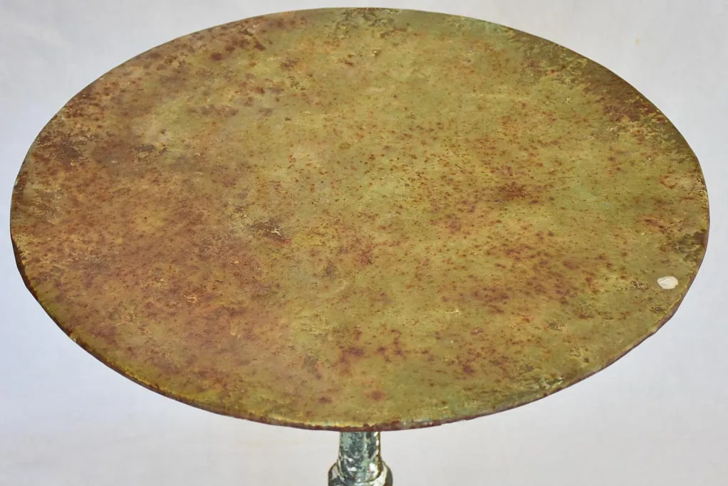 Art Nouveau bistro table with red and green patina